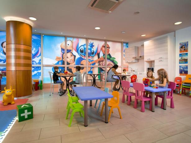 Children's play area with colorful tables and vibrant decorations.